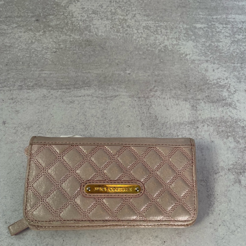 Juicy couture pink shimmer wallet with black and white polka dot details inside